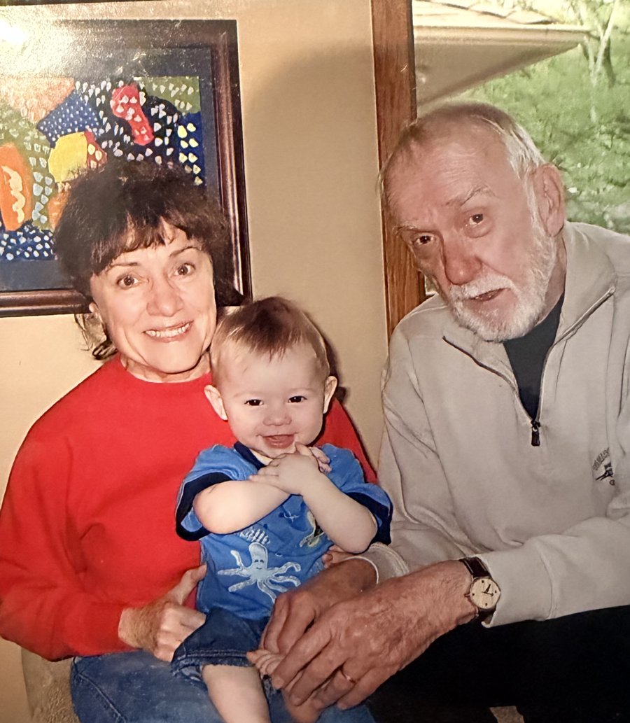 Beverly DeJulio holding the founder as a baby, next to his grandfather