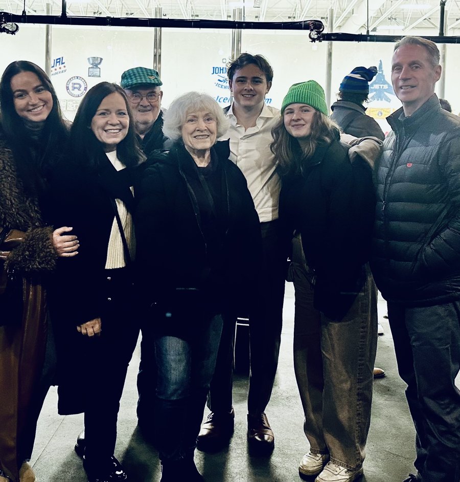 Beverly with three generations of family at the founder's hockey game